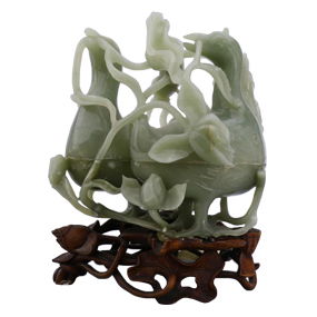 A Chinese jade carving of two conjoined duck-form boxes and lotuses