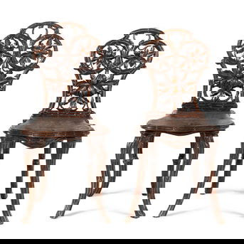 A Pair of Black Forest Oak Leaf Carved Side Chairs